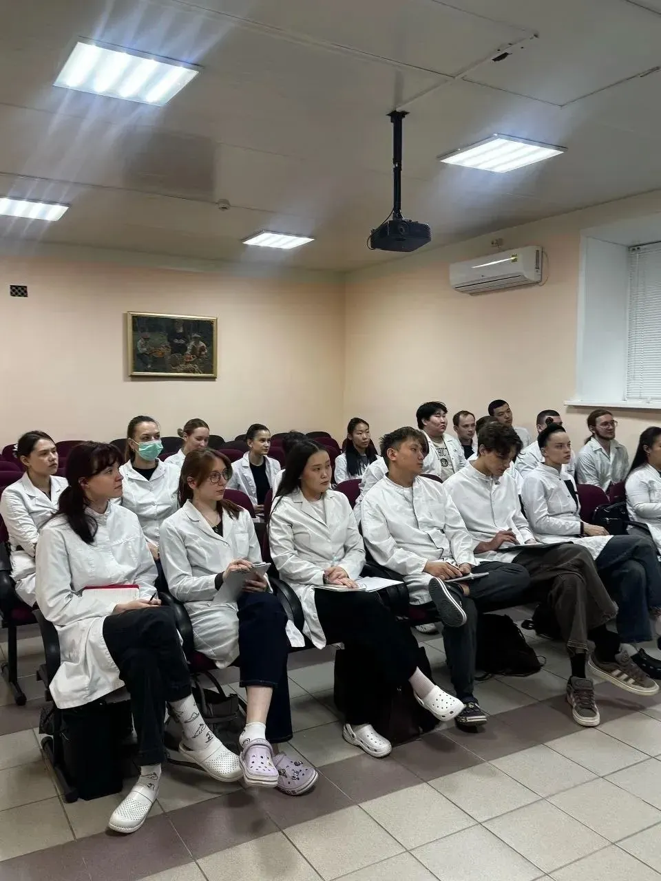 Medical students presenting research on chest pain diagnosis and cardiology at Amur State Medical Academy
