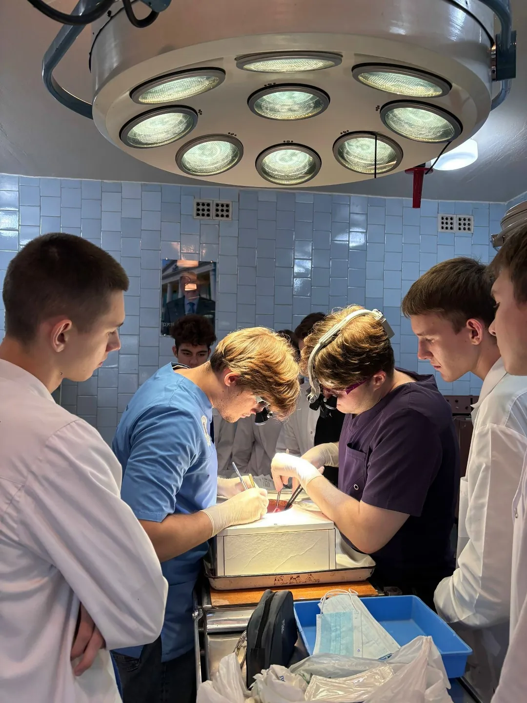 Medical students practicing coronary artery bypass surgery techniques