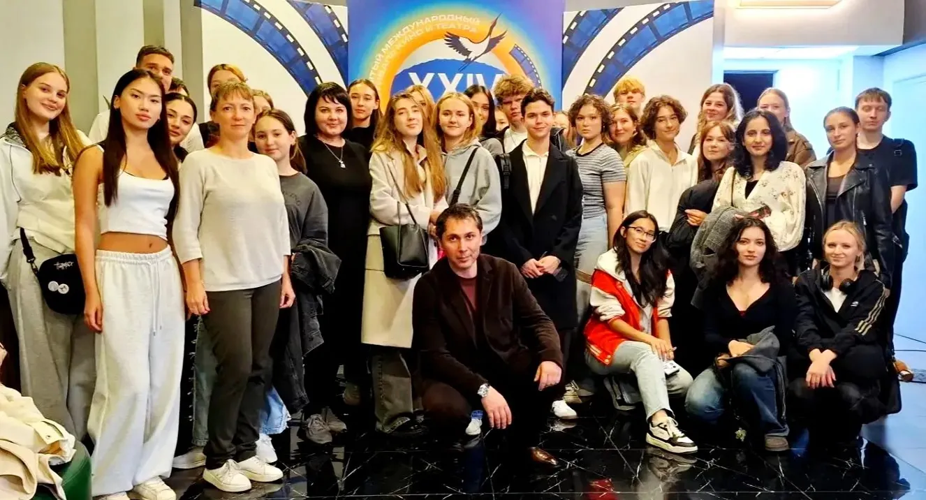 Film director Amur Amerkhanov photographed with medical students and teachers after the screening